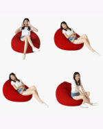 a woman sitting on a red bean bag