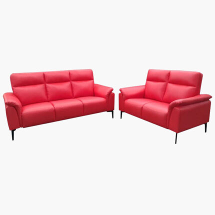 Two red loveseat sofas